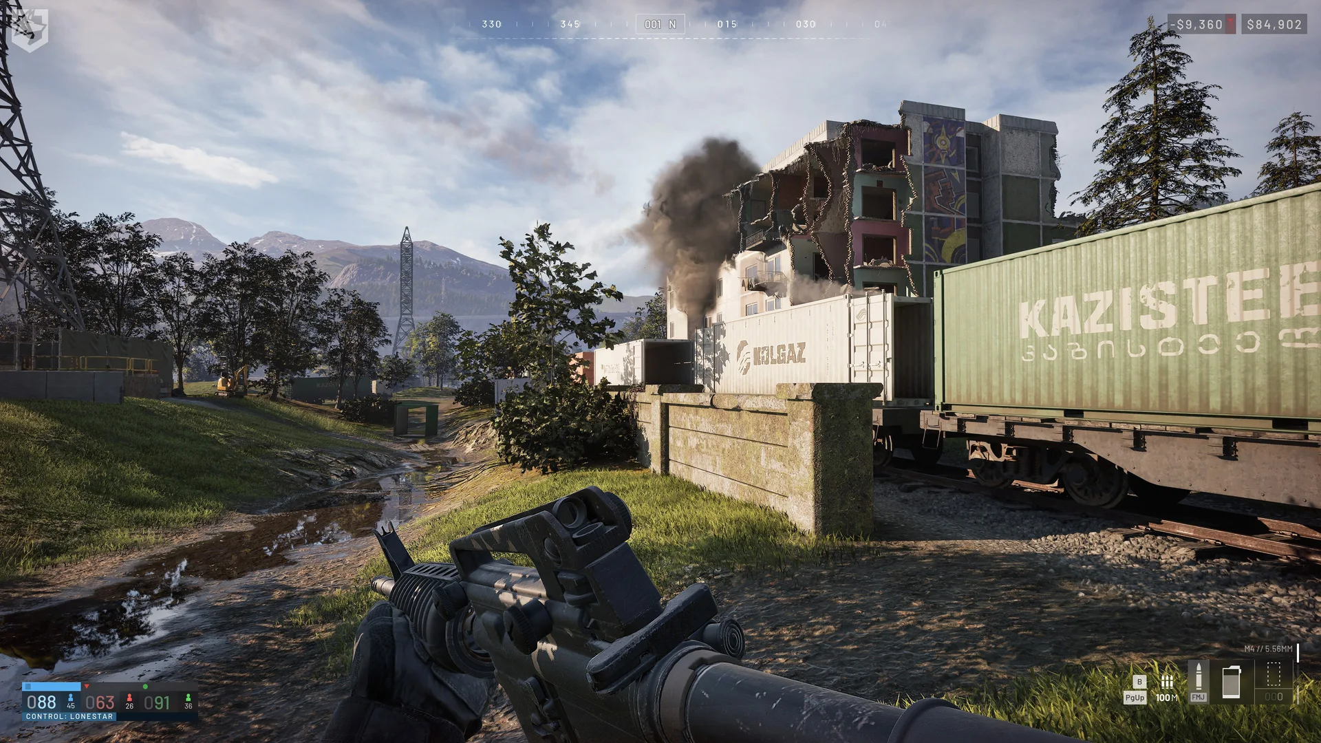 A damaged apartment block beyond railway freight cars in WARDOGS.