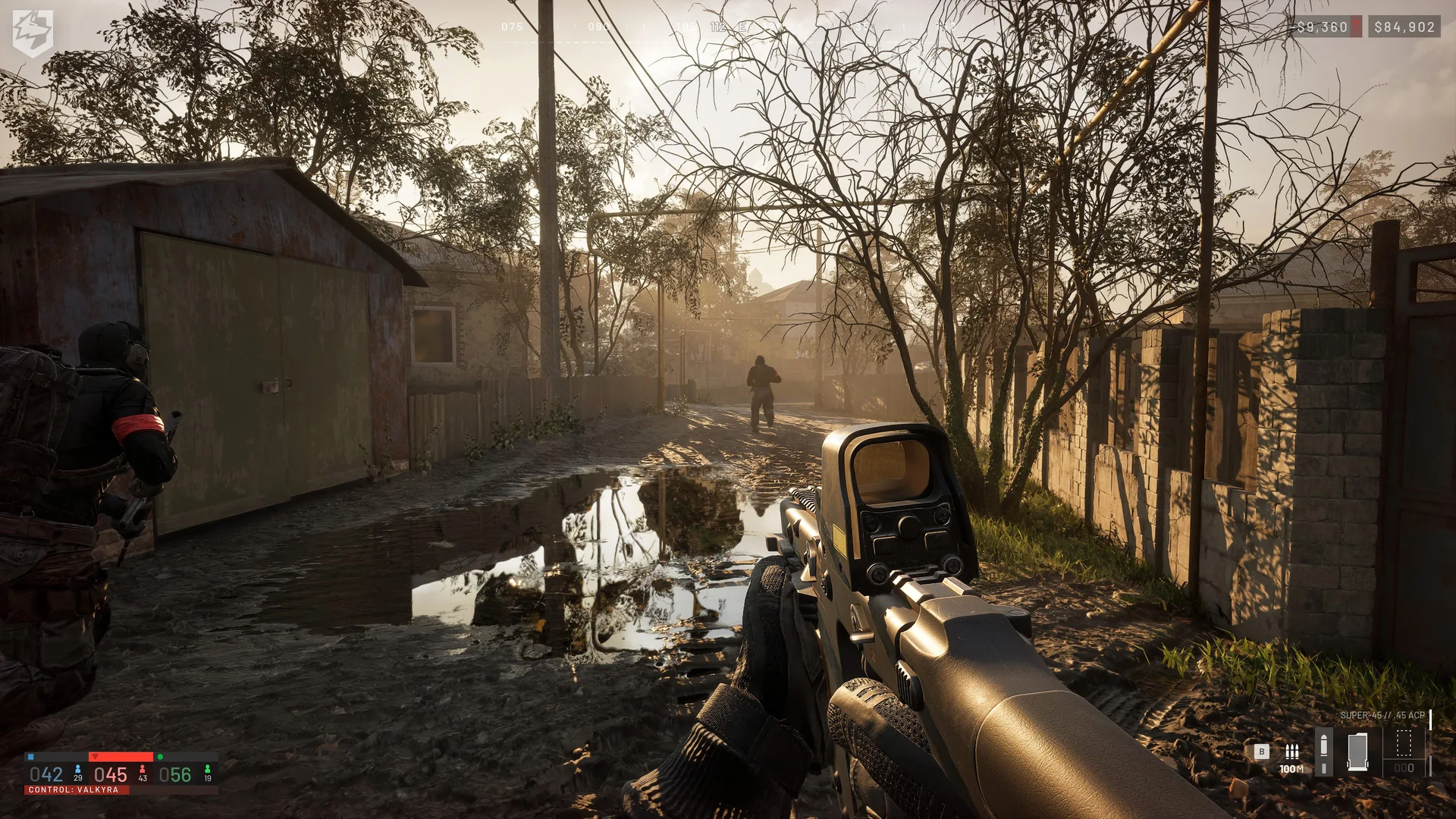 A squad advances along a flooded residential lane in WARDOGS.