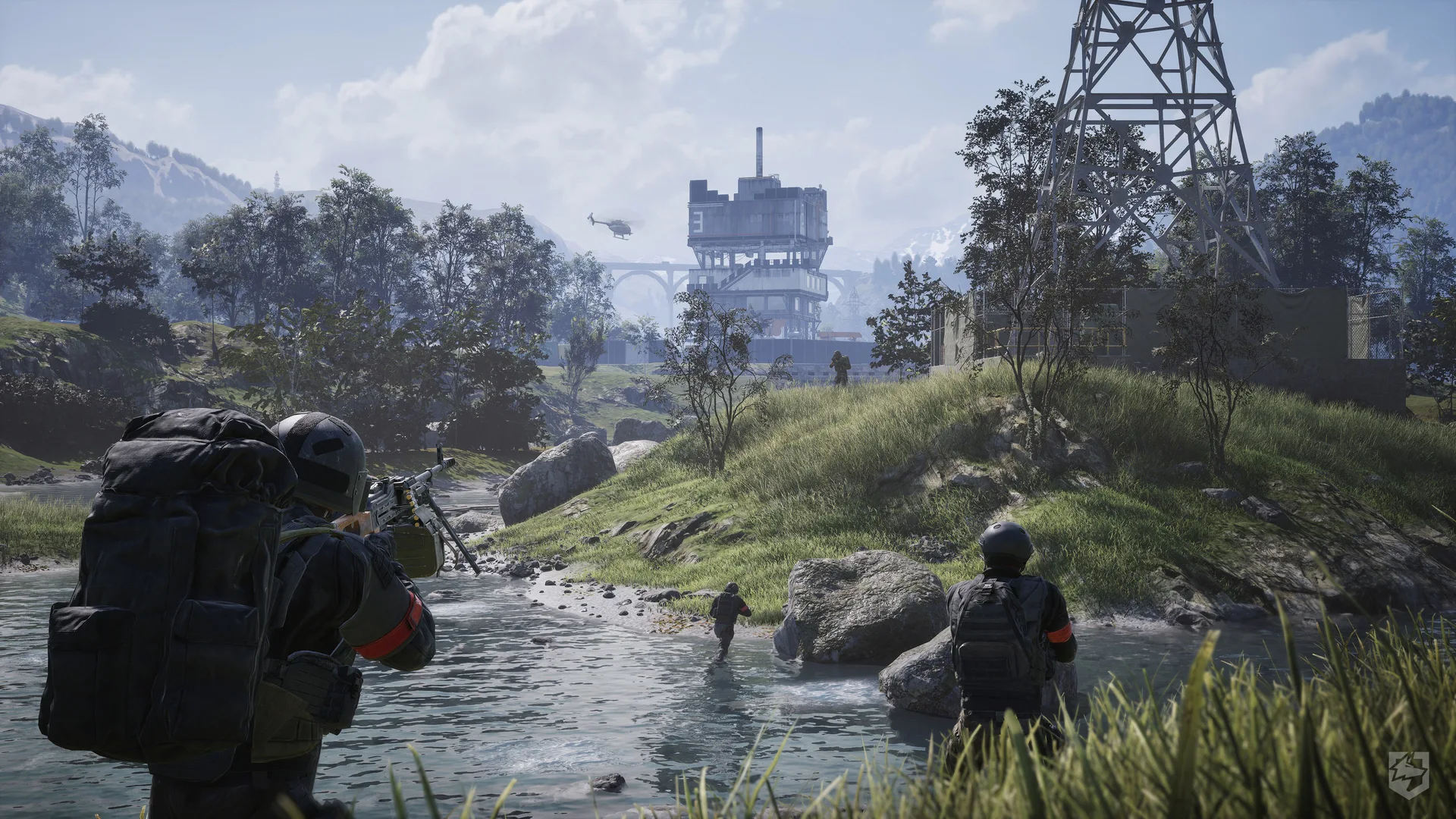A squad crosses a river toward a tower in official WARDOGS footage.